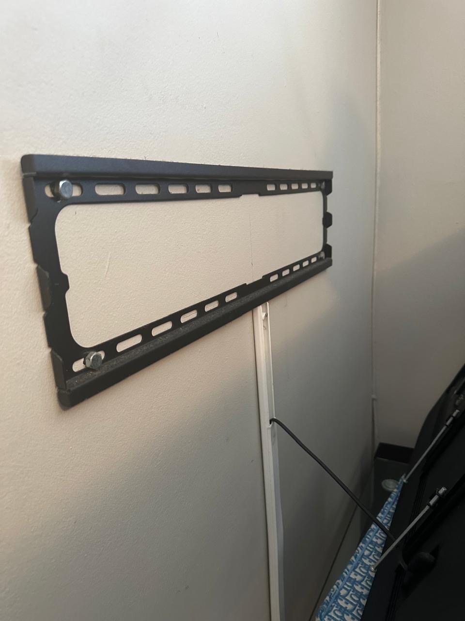 Heavy-duty TV wall mount bracket installed